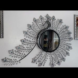 A black peacock mirror